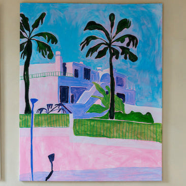 Painting of a building with palm trees on a wall